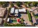 Stunning aerial shot highlighting a spacious backyard with a sparkling pool and well-manicured landscaping at 8675 S College Ln, Tempe, AZ 85284