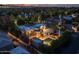 Night aerial shot of home showcasing pool, yard, desert landscaping, and mountain views at 8675 S College Ln, Tempe, AZ 85284