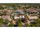 Aerial view captures the neighborhood setting, highlighting home's landscaping and yards at 8675 S College Ln, Tempe, AZ 85284