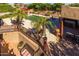 Stunning view of backyard with multiple patio areas, swimming pool, desert landscaping, and outdoor bar at 8675 S College Ln, Tempe, AZ 85284