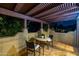 Charming outdoor balcony with tile flooring, pergola, and dining set perfect for relaxation at 8675 S College Ln, Tempe, AZ 85284