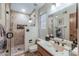 Beautifully updated bathroom with a sleek, glass-enclosed shower and modern vanity at 8675 S College Ln, Tempe, AZ 85284