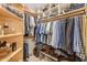 Walk-in closet featuring custom built-ins, shelving, and ample storage space at 8675 S College Ln, Tempe, AZ 85284