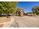 Attractive gated community entrance with Tudor-style guard house and brick signage in a landscaped setting at 8675 S College Ln, Tempe, AZ 85284