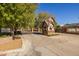 Welcoming gated community entrance with brick signage and a view of mature trees at 8675 S College Ln, Tempe, AZ 85284