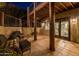 Relax on this covered patio with rustic pillars, tile flooring and easy access to the outdoors at 8675 S College Ln, Tempe, AZ 85284