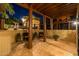 Covered patio with rustic pillars, tile flooring, and comfortable seating offers scenic views at 8675 S College Ln, Tempe, AZ 85284