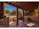 Enchanting covered patio area offers comfortable seating and shade, overlooking the manicured grounds at 8675 S College Ln, Tempe, AZ 85284