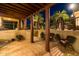 Inviting covered patio features tile flooring, outdoor seating, and picturesque backyard views at 8675 S College Ln, Tempe, AZ 85284
