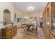 Open dining room featuring a wood table, accent rug, and built in cabinetry at 8675 S College Ln, Tempe, AZ 85284