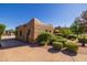 Southwestern-style home with a well-maintained exterior and mature landscaping that adds character and privacy to the property at 8675 S College Ln, Tempe, AZ 85284