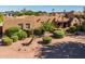 Charming Southwestern-style home featuring a meticulously landscaped yard and a welcoming entrance, perfect for comfortable living at 8675 S College Ln, Tempe, AZ 85284