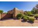 Charming home with gated driveway, mature landscaping and Southwestern architectural details at 8675 S College Ln, Tempe, AZ 85284