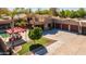 Charming single-Gathering home features a spacious driveway, three-car garage, and well-manicured lawn at 8675 S College Ln, Tempe, AZ 85284