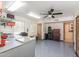 A garage with a work bench, lots of storage, and a door to an adjacent room at 8675 S College Ln, Tempe, AZ 85284