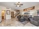 Comfortable living room featuring tiled floors, neutral walls, and views of stairs at 8675 S College Ln, Tempe, AZ 85284