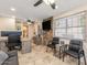Inviting home office featuring a stone accent wall, tiled flooring, and convenient access to the updated bathroom at 8675 S College Ln, Tempe, AZ 85284