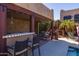 Relaxing outdoor bar and patio area with seating, perfect for enjoying the pool view at 8675 S College Ln, Tempe, AZ 85284