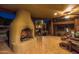 Enjoy this outdoor space with fireplace and comfortable seating in a private covered patio at 8675 S College Ln, Tempe, AZ 85284