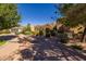 Beautiful home with well manicured landscaping and trees, creating an inviting ambiance in a serene neighborhood at 8675 S College Ln, Tempe, AZ 85284