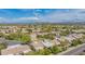 Aerial view of homes with lush trees and golf course views within the community at 8839 W Rimrock Dr, Peoria, AZ 85382