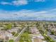 Stunning aerial view showcases the home's location in a golf course community with mountain views at 8839 W Rimrock Dr, Peoria, AZ 85382