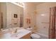 Bathroom featuring a tub-shower combo and a mirrored vanity with good lighting, a practical space at 8839 W Rimrock Dr, Peoria, AZ 85382