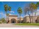 Well-maintained building featuring stone accents, palm trees, and inviting entrance area at 8839 W Rimrock Dr, Peoria, AZ 85382