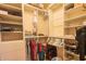 Organized walk-in closet with ample shelving and hanging space for efficient storage solutions at 8839 W Rimrock Dr, Peoria, AZ 85382