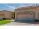 Single-story home featuring a two-car garage, driveway, and desert landscaping under a blue, partly cloudy sky at 8839 W Rimrock Dr, Peoria, AZ 85382