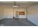 Spacious garage with ample storage cabinets and epoxy flooring, ideal for organization and functionality at 8839 W Rimrock Dr, Peoria, AZ 85382