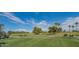 Beautifully maintained golf course showcasing lush green fairways, mature trees, and clear blue skies at 8839 W Rimrock Dr, Peoria, AZ 85382