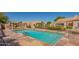 Relaxing community pool with stone decking, sun loungers, and well-maintained landscaping at 8839 W Rimrock Dr, Peoria, AZ 85382