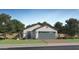 Charming single-story home with a well-manicured lawn and a two-car garage with a brick driveway at 9519 W Catalina Dr, Phoenix, AZ 85037