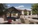 Outdoor picnic area features covered seating, BBQ grill, and a trash can, ideal for community gatherings at 9519 W Catalina Dr, Phoenix, AZ 85037