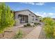Private backyard patio featuring brick walkway and lush desert landscaping at 9715 E Allison Way, Scottsdale, AZ 85262