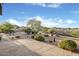 Desert landscaping in a private backyard with a stone patio at 9715 E Allison Way, Scottsdale, AZ 85262