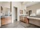Expansive bathroom offers tile flooring, dual vanities, a toilet room, and mirrors at 9715 E Allison Way, Scottsdale, AZ 85262