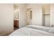 Bright bedroom featuring ensuite bath, walk-in closet, and neutral decor at 9715 E Allison Way, Scottsdale, AZ 85262