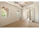 Bright, carpeted bedroom with modern fixtures and a bright window at 9715 E Allison Way, Scottsdale, AZ 85262