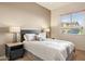 Cozy bedroom featuring a queen bed, bedside tables, and a window with natural light at 9715 E Allison Way, Scottsdale, AZ 85262