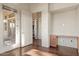 Bright bedroom boasts wood floors, desk, and access to a balcony, creating a flexible living space at 9715 E Allison Way, Scottsdale, AZ 85262