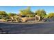 Elegant community sign for 'El Canto at Mirabel' surrounded by beautiful desert landscaping at 9715 E Allison Way, Scottsdale, AZ 85262