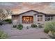 Home exterior shows patio, built-in fireplace, desert landscaping, and architecture at 9715 E Allison Way, Scottsdale, AZ 85262