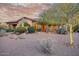 Charming home featuring desert landscaping with mature trees, cacti, and a warm, inviting color palette at 9715 E Allison Way, Scottsdale, AZ 85262