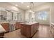 Open kitchen with center island, breakfast bar, granite countertops, and stainless appliances at 9715 E Allison Way, Scottsdale, AZ 85262