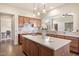 Modern kitchen features an island, granite countertops, and stainless steel appliances at 9715 E Allison Way, Scottsdale, AZ 85262