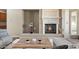 Bright living room featuring a stone fireplace and comfortable seating arrangements at 9715 E Allison Way, Scottsdale, AZ 85262
