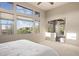 Spacious primary bedroom with multiple large windows and neutral carpet provides great natural light at 9715 E Allison Way, Scottsdale, AZ 85262