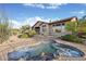 Inviting backyard spa with rock accents and ample privacy at 9715 E Allison Way, Scottsdale, AZ 85262